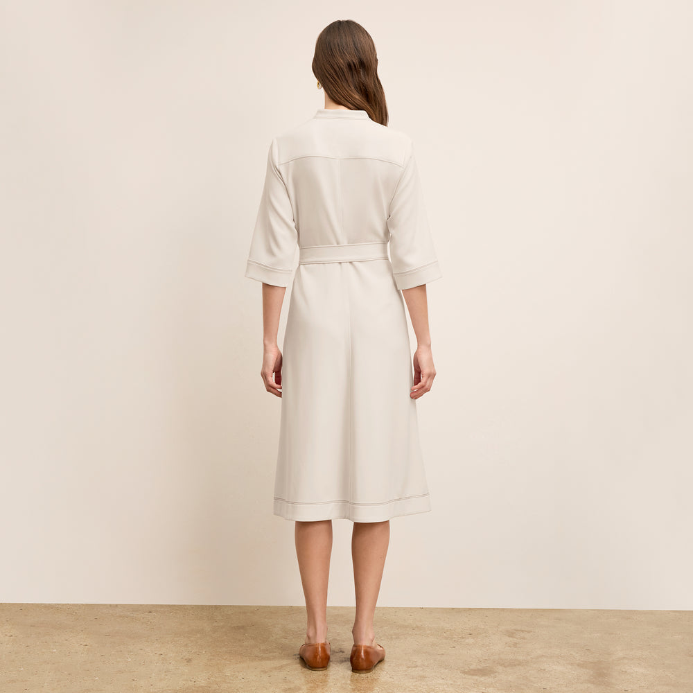 back image of a woman wearing the laueleh dress in eggshell