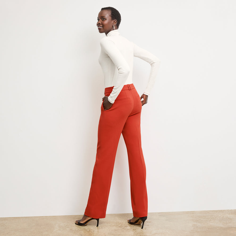back image of a woman wearing the lowen pant in ginger with topstitch
