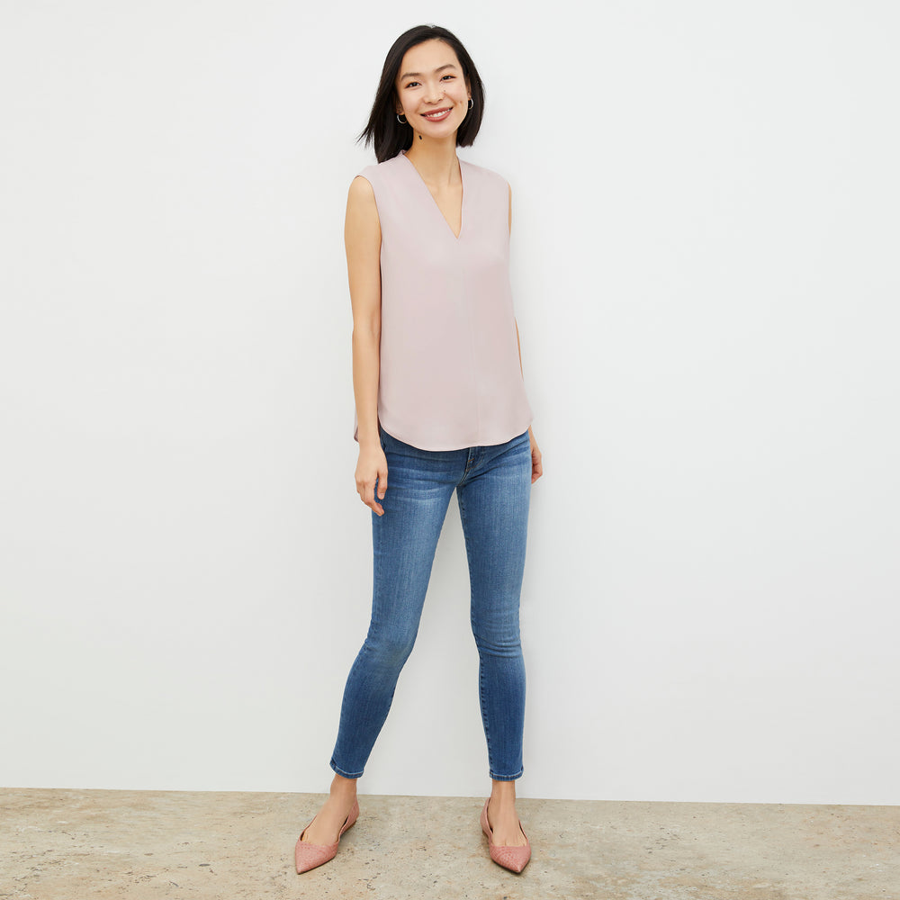 Image of a woman wearing the Emmy top in Blossom