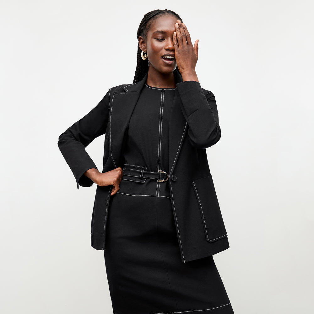 front image of a woman wearing the grenville jacket in black