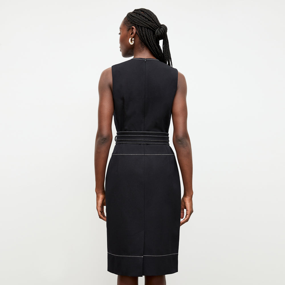 back image of a woman wearing the maude dress in black