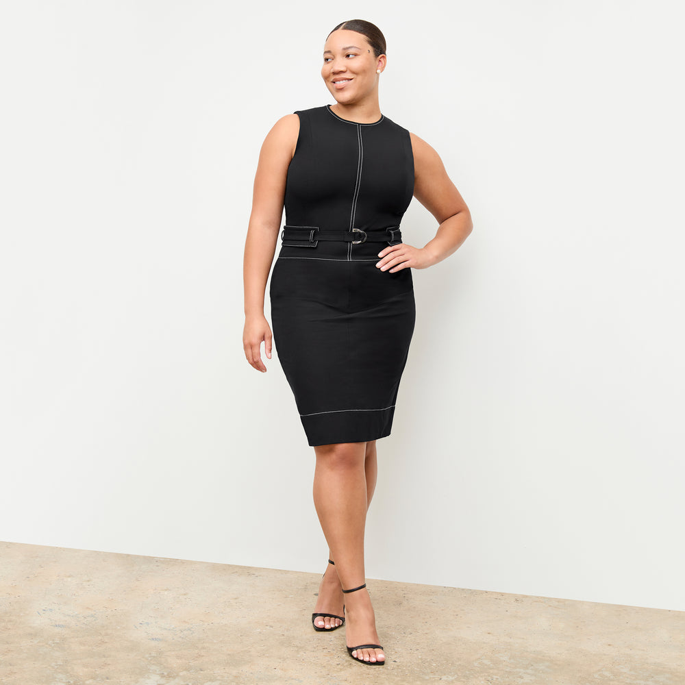 front image of a woman wearing the maude dress in black