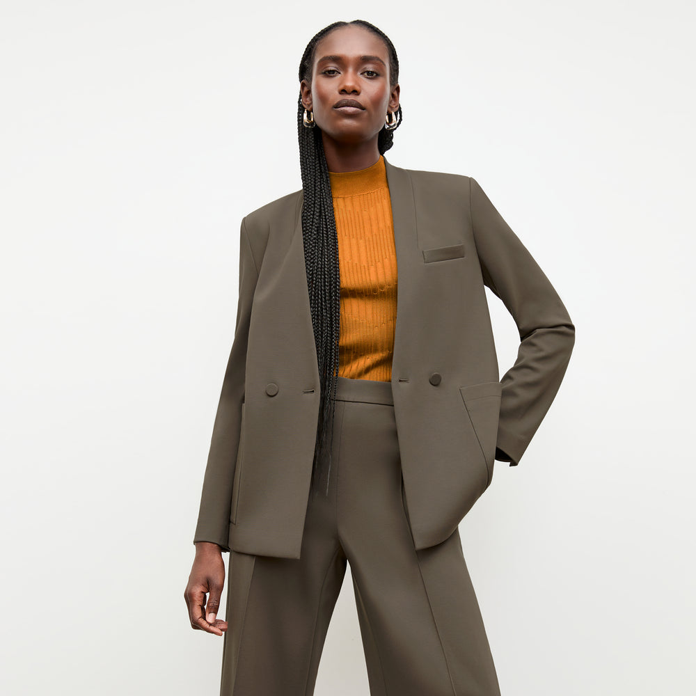 front image of a woman wearing the janette jacket in ash