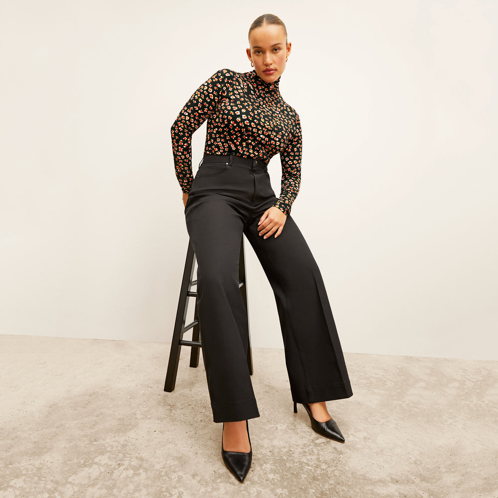 Front image of a woman wearing the Milo Jean in Black
