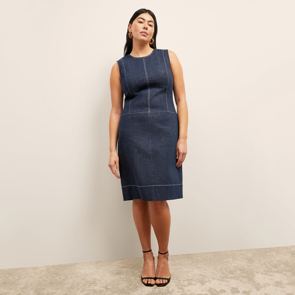 front image of a woman wearing the maude dress in dark wash