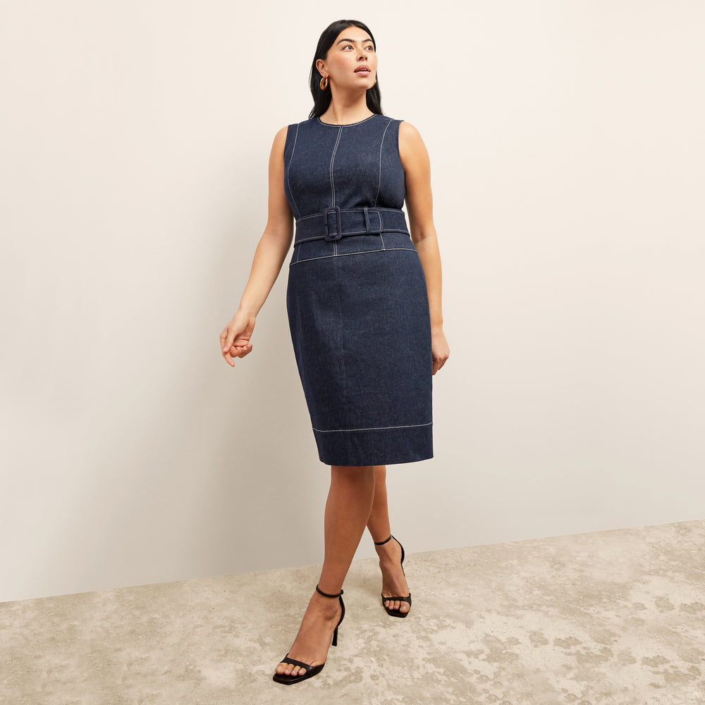front image of a woman wearing the maude dress in dark wash