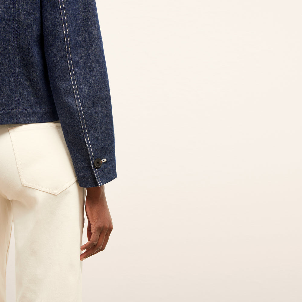 detail image of a woman wearing the kane jacket in dark wash