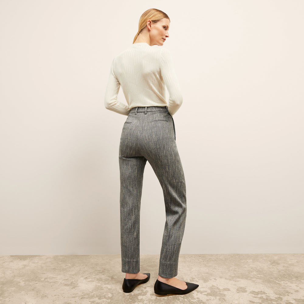 Back image of a woman wearing the brodie top in ivory