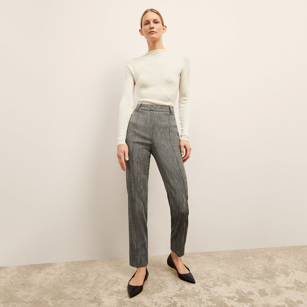 front image of a woman wearing the brodie top in ivory