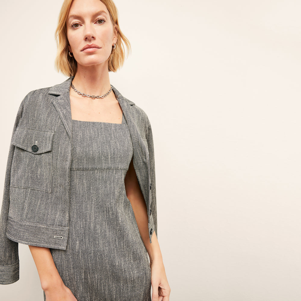 front image of a woman wearing the rhoda jacket in black/ivory