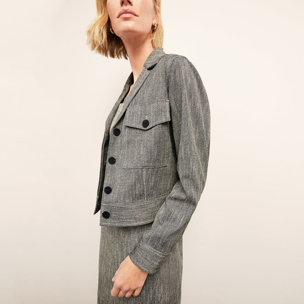 front image of a woman wearing the rhoda jacket in black/ivory