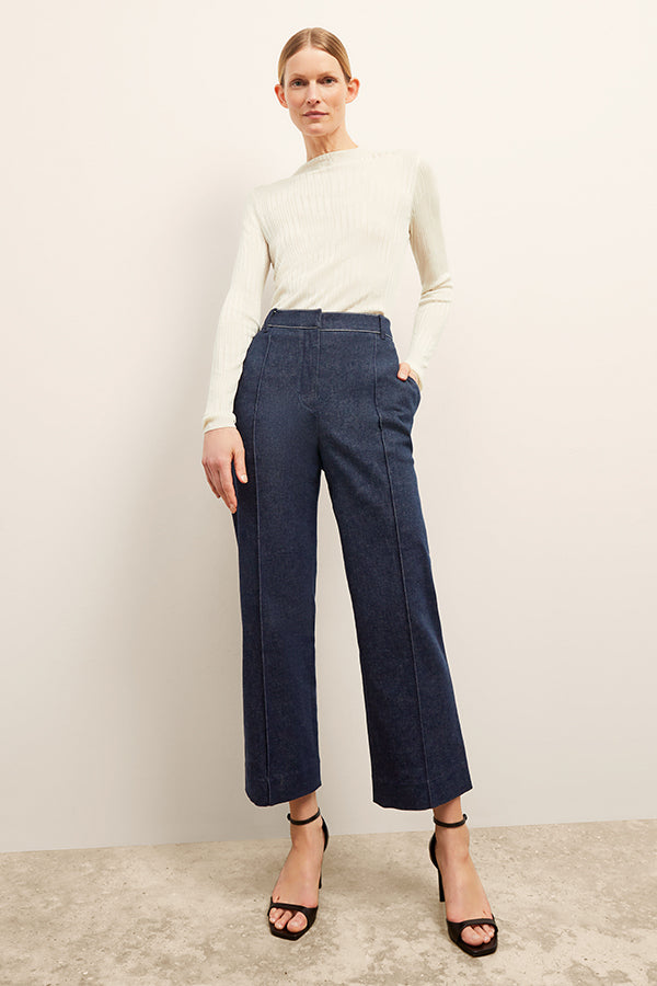front image of a woman wearing the christy pant in dark wash