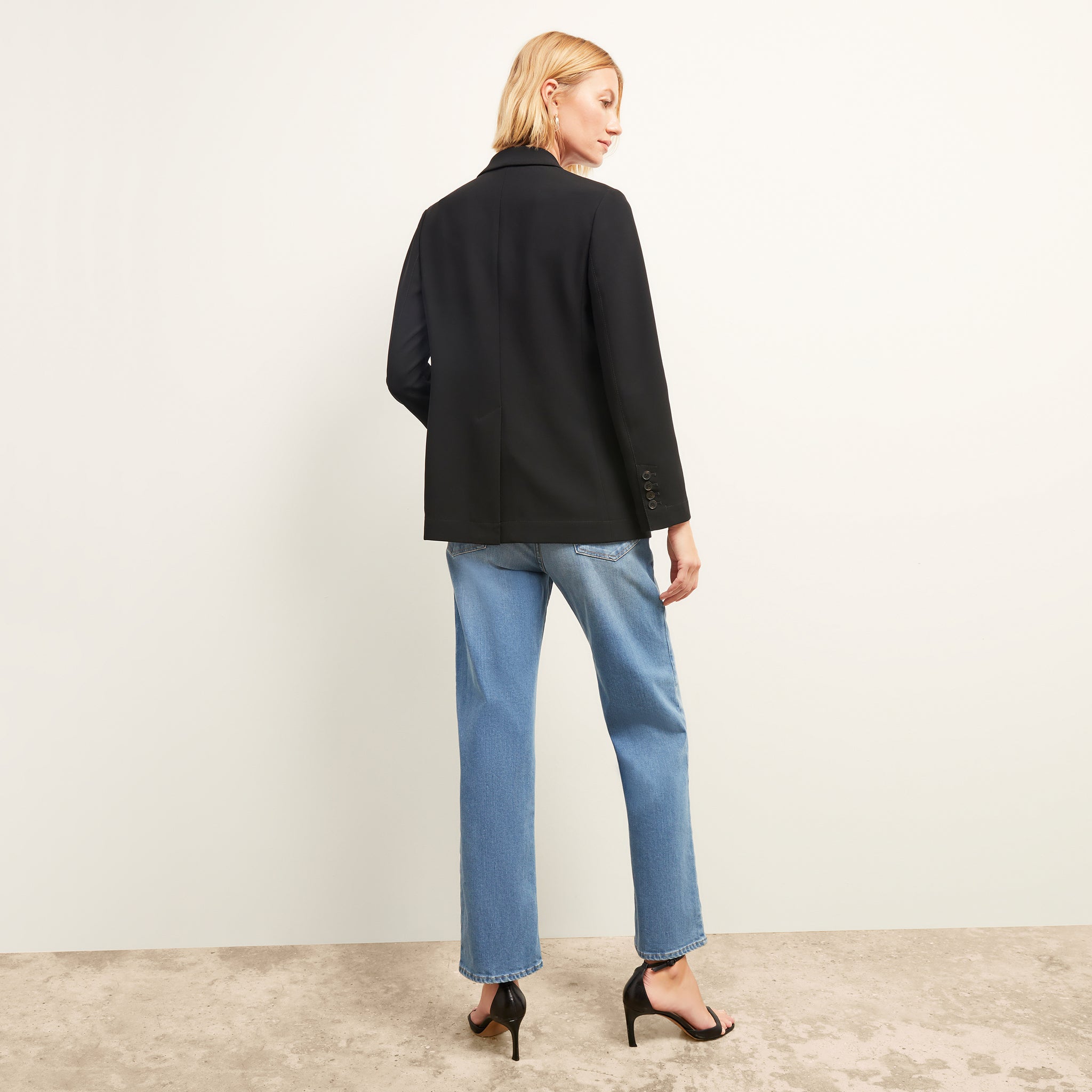 black image of a woman wearing the ohara jacket in black