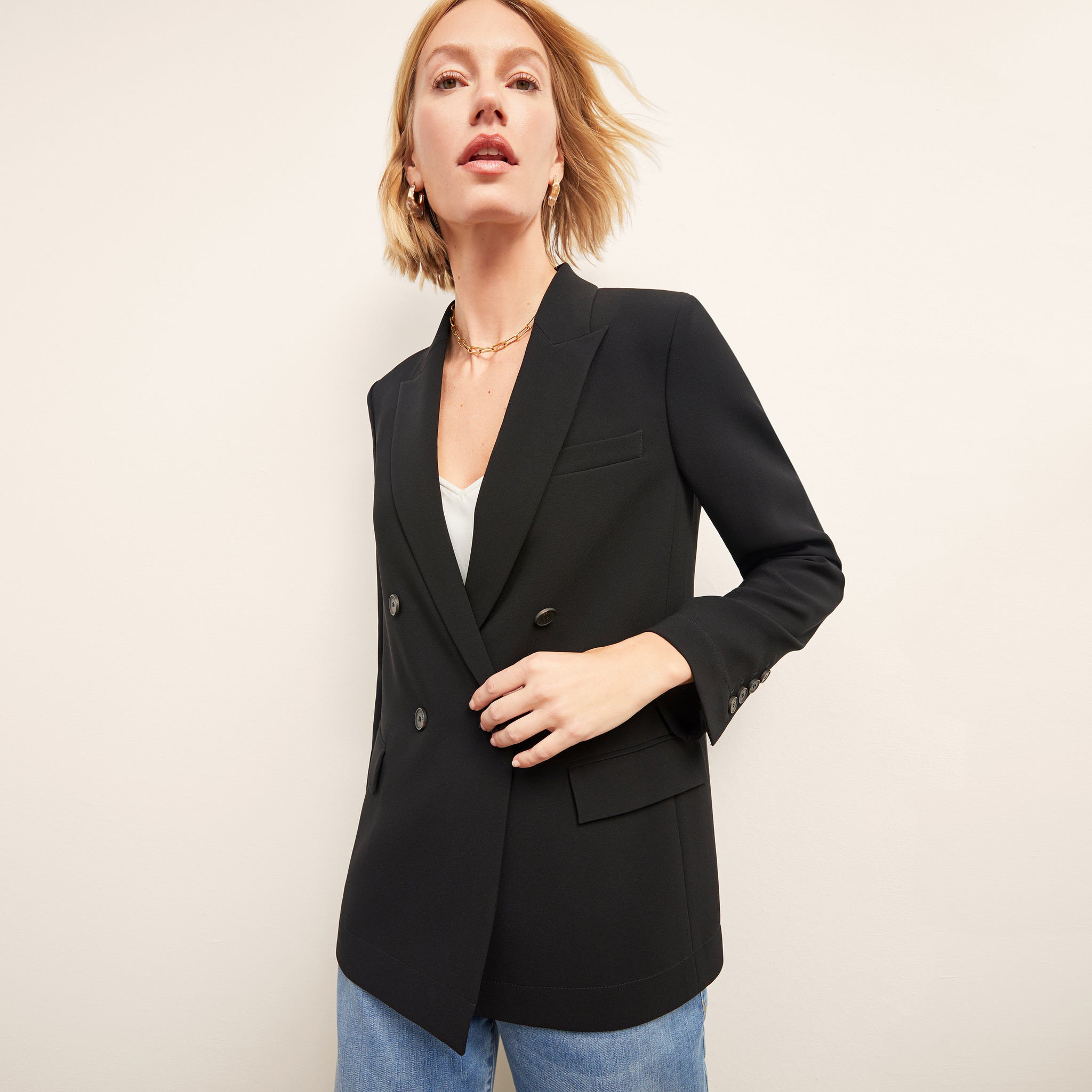 front image of a woman wearing the ohara jacket in black 
