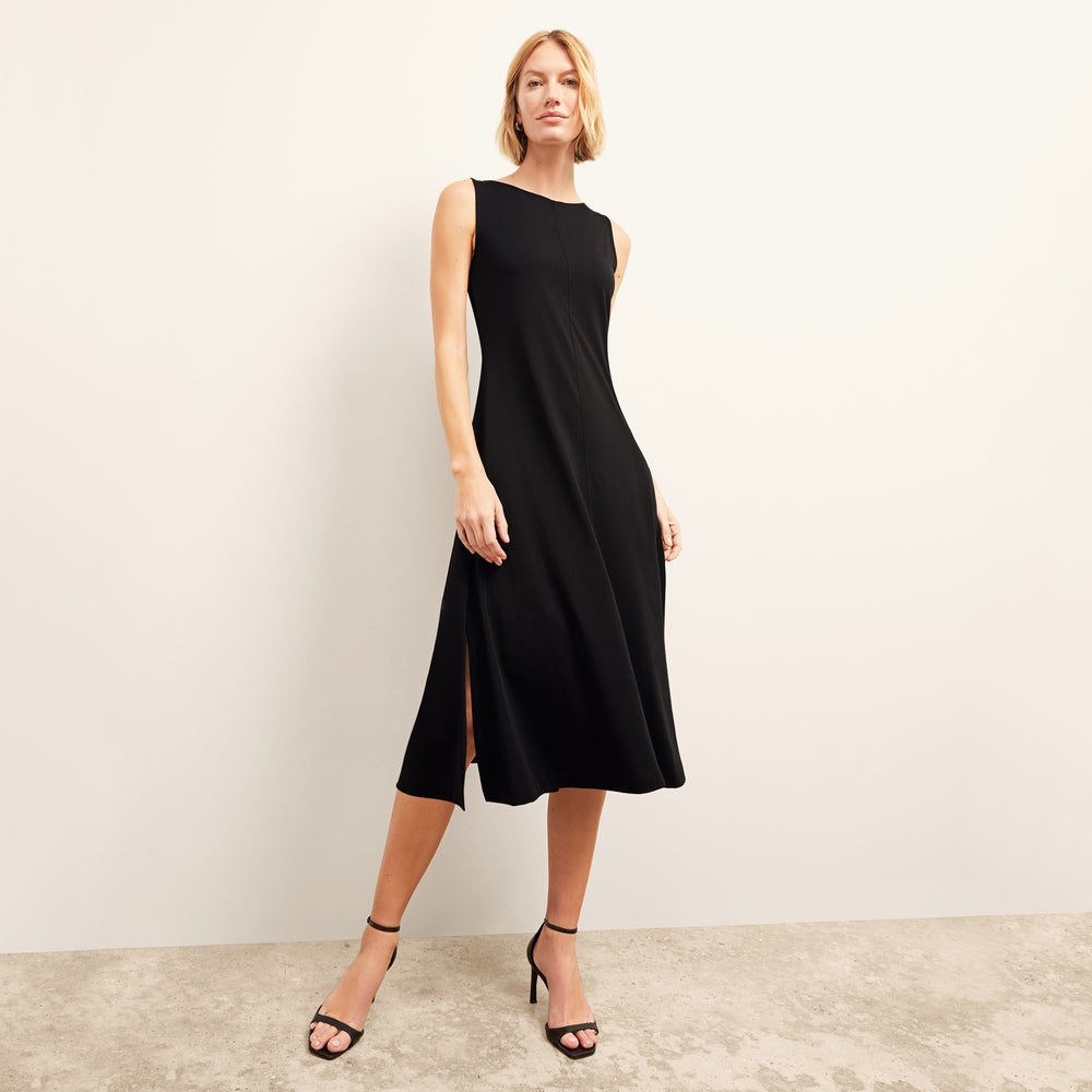 front image of a woman wearing the milano dress in black