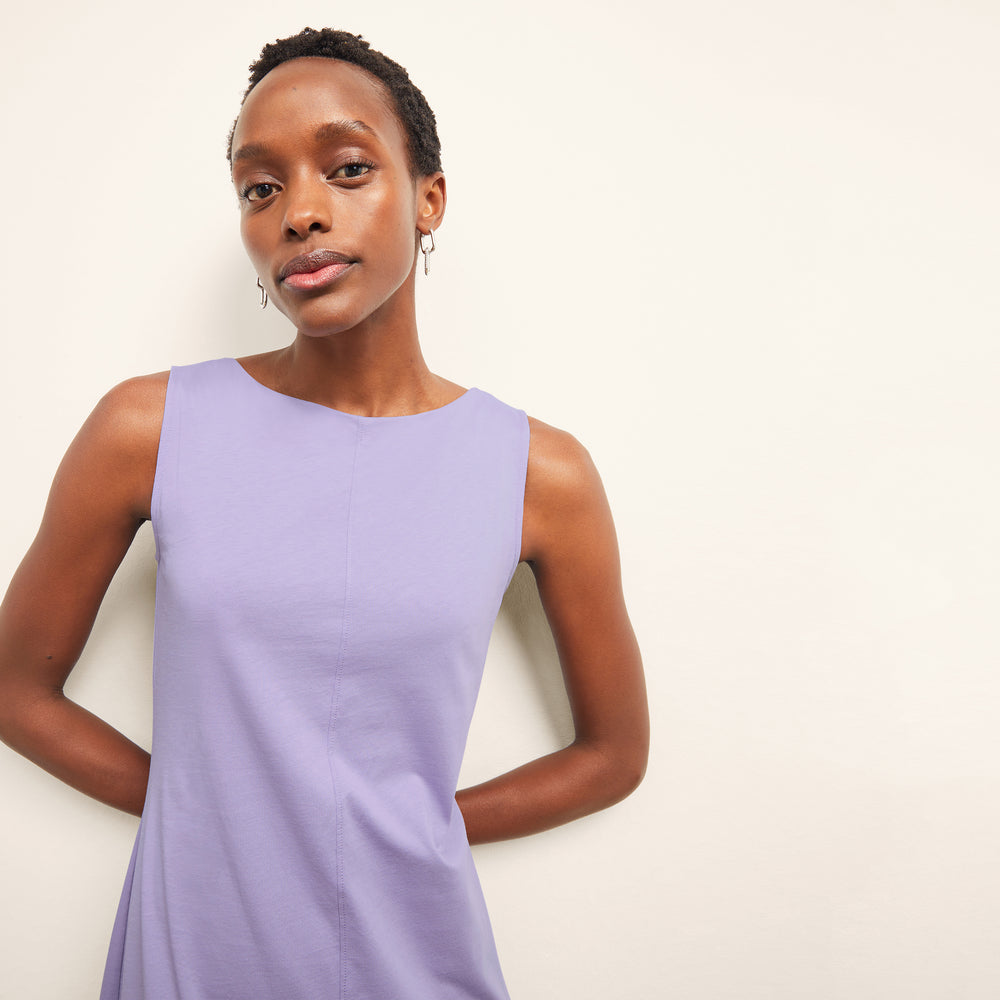 front image of a woman wearing the milano dress in light orchid