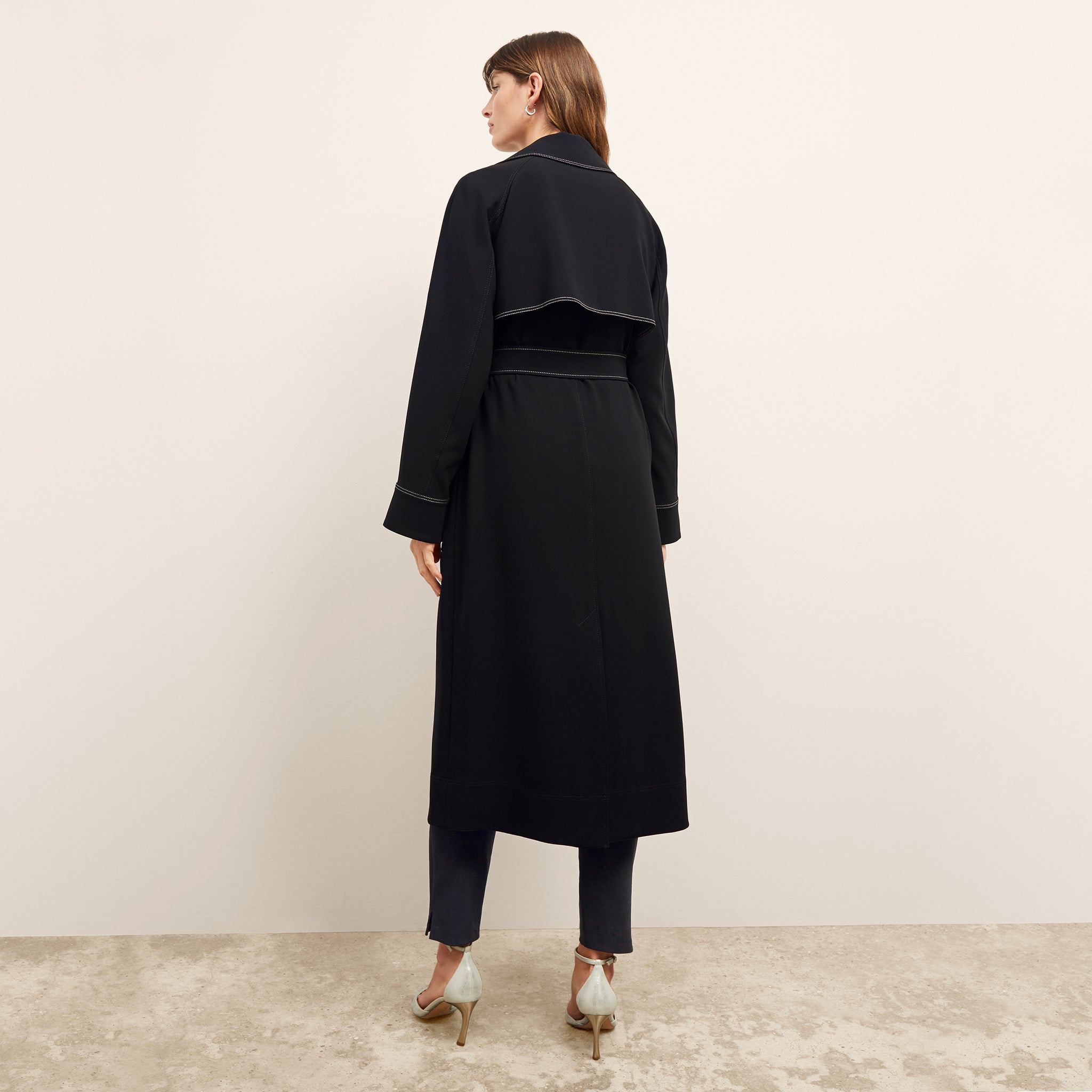 back image of a woman wearing the frankie jacket in black