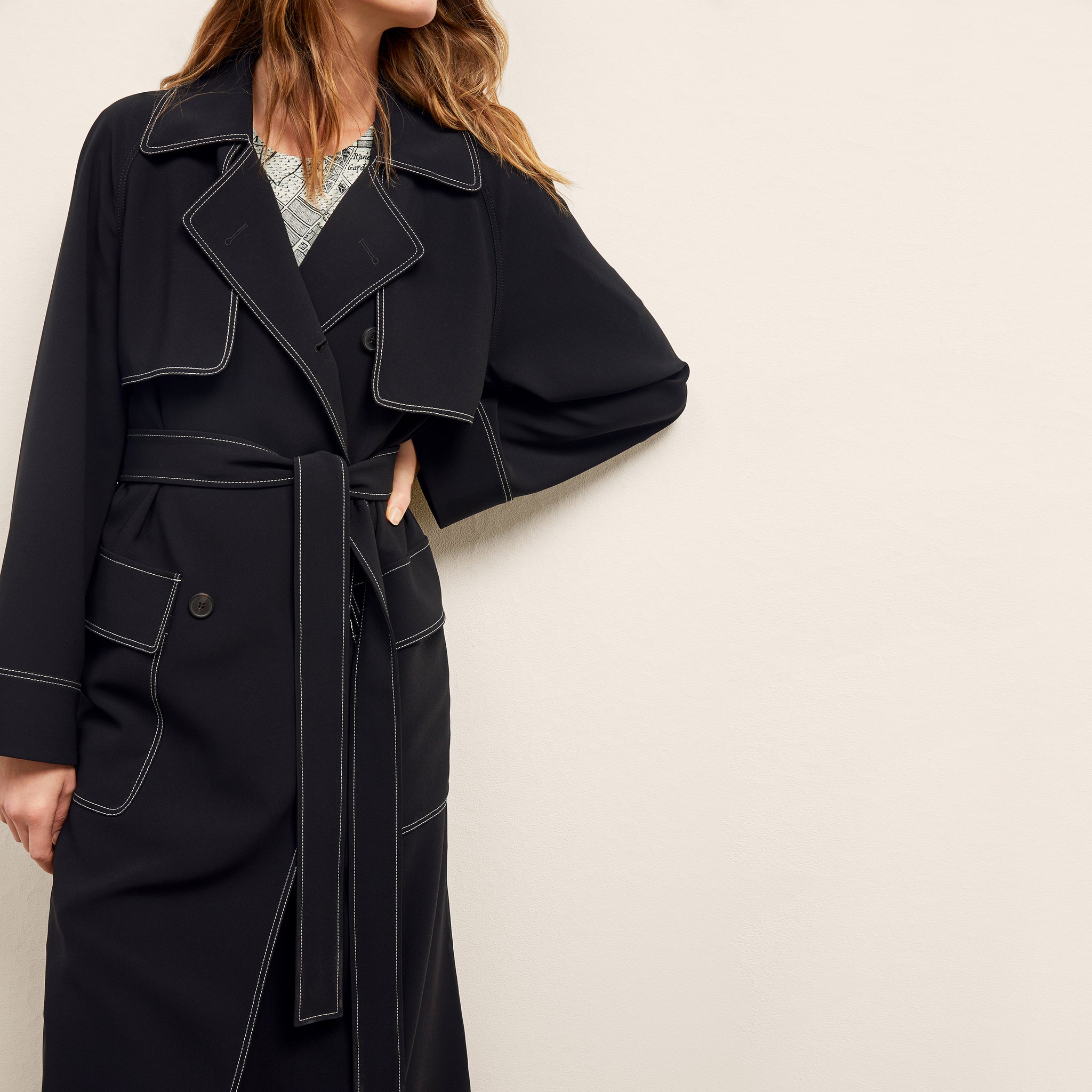front image of a woman wearing the frankie jacket in black