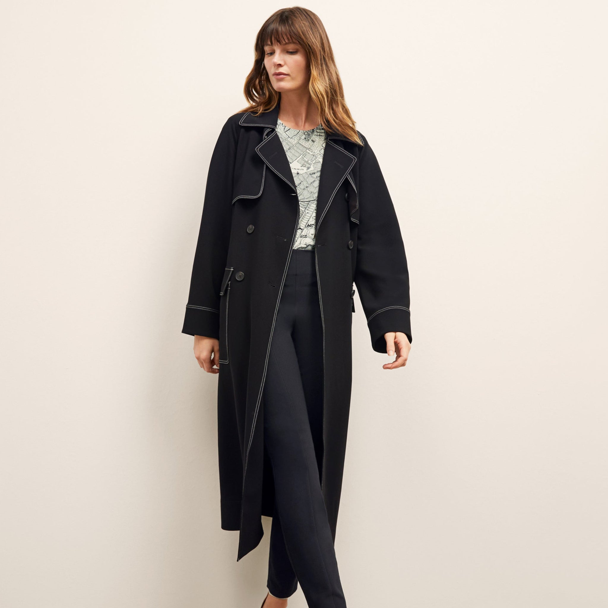 front image of a woman wearing the frankie jacket in black 