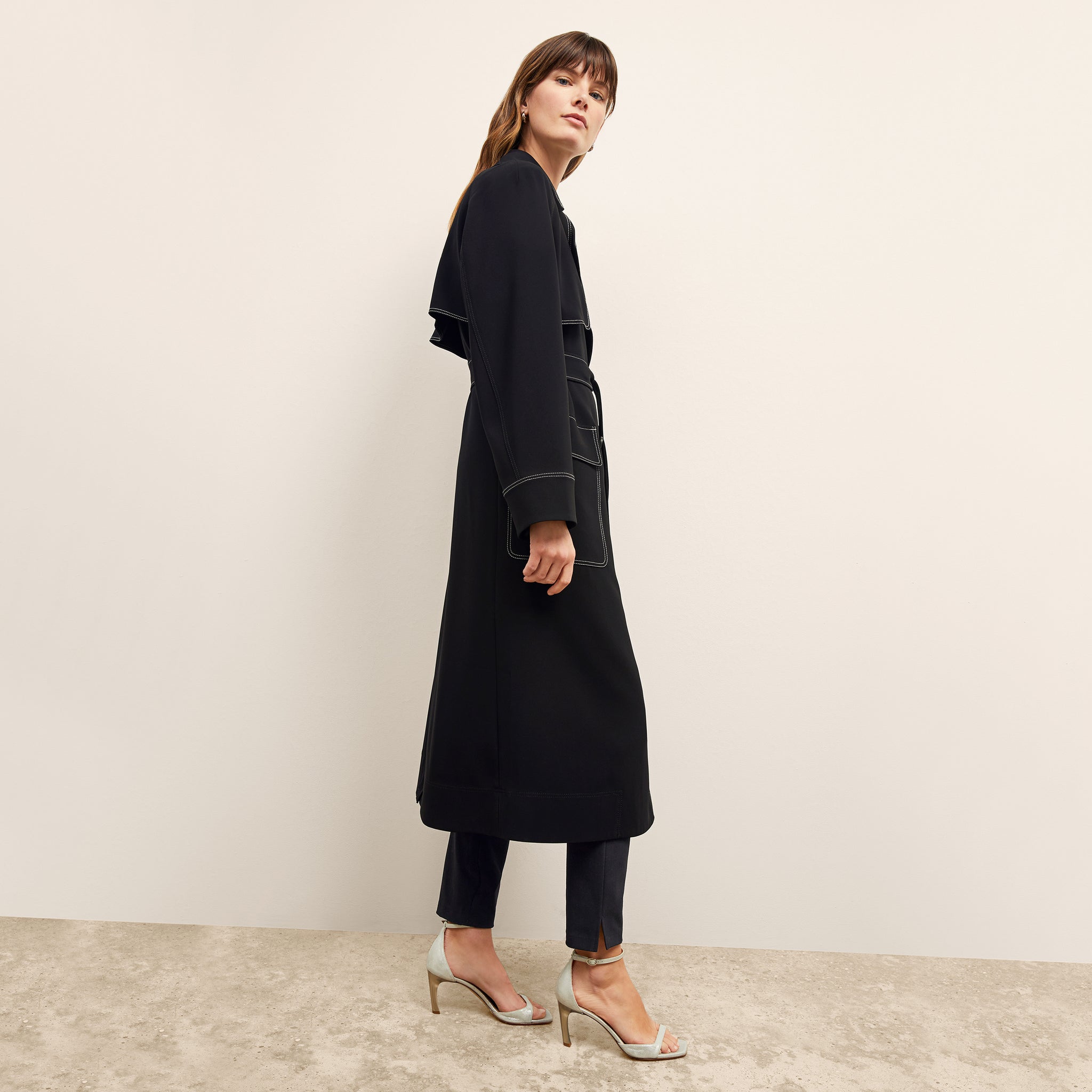 side image of a woman wearing the frankie jacket in black