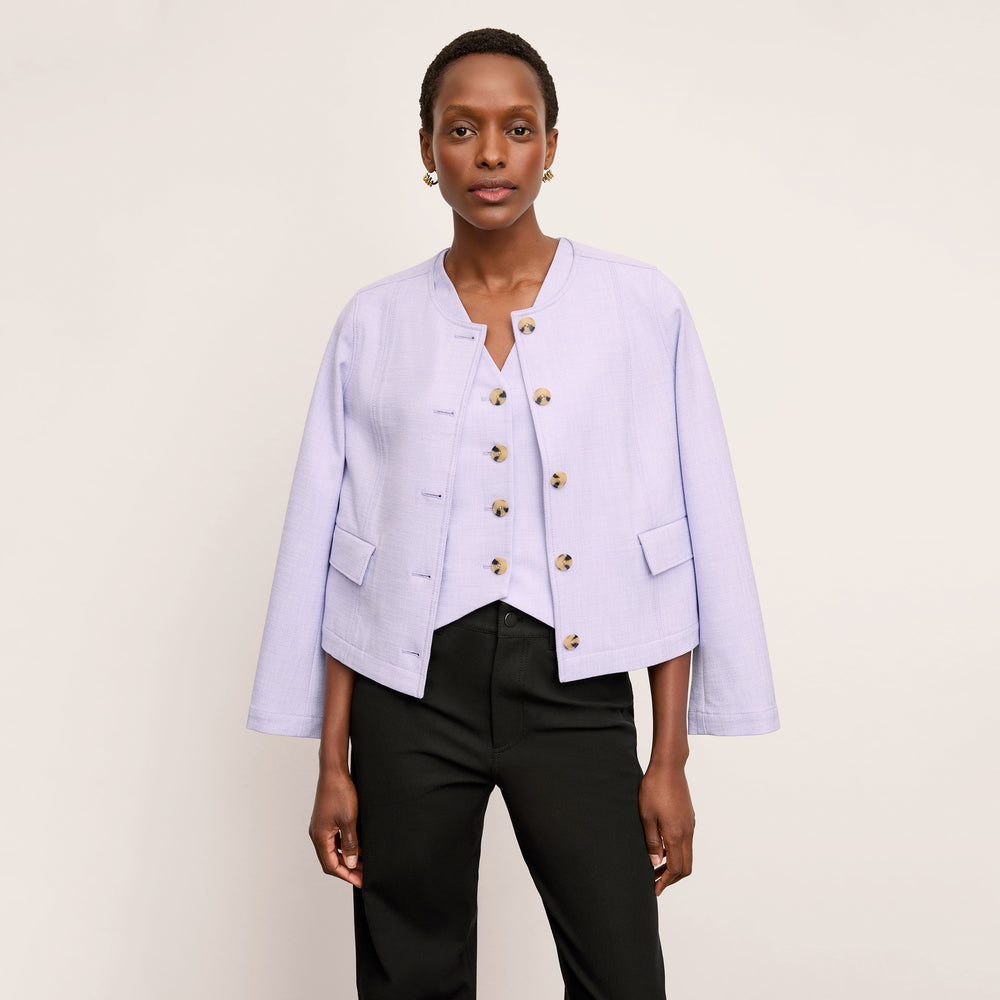 front image of a woman wearing the aniya jacket in lilac/ivory