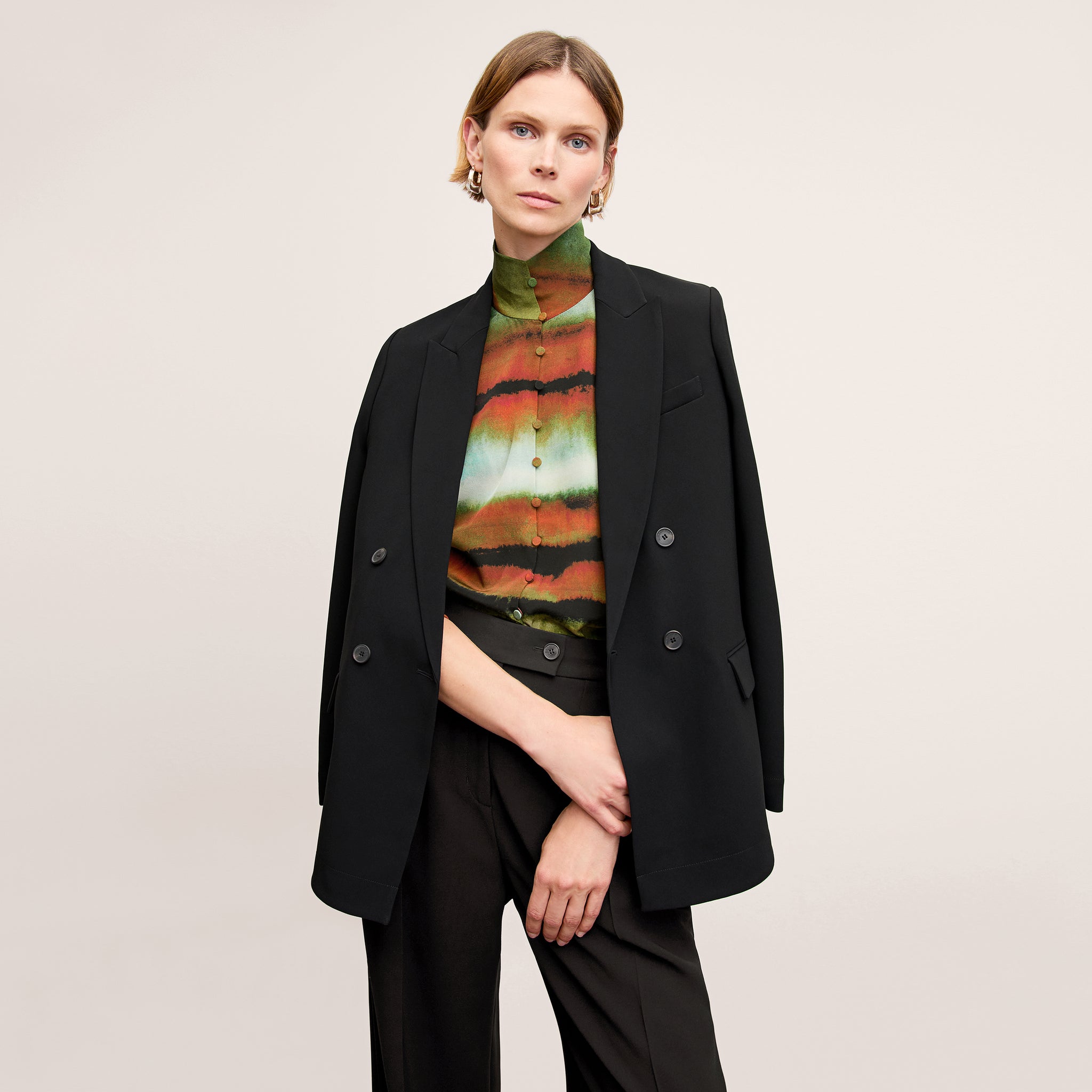 front image of a woman wearing the ohara jacket in black 
