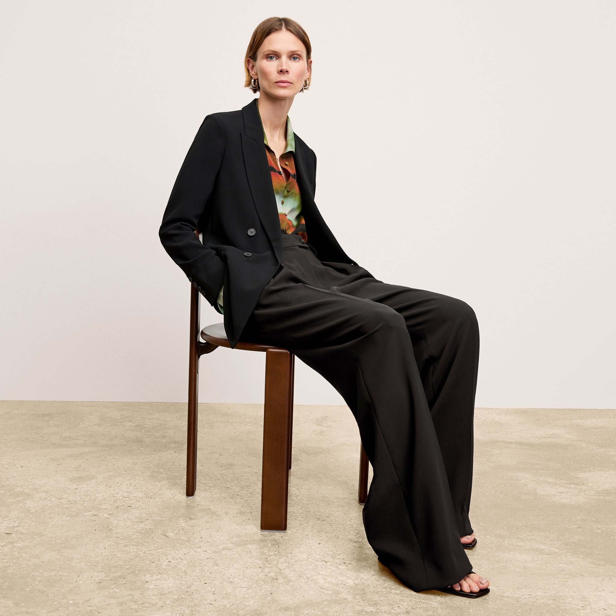 front image of a woman wearing the ohara jacket in black 