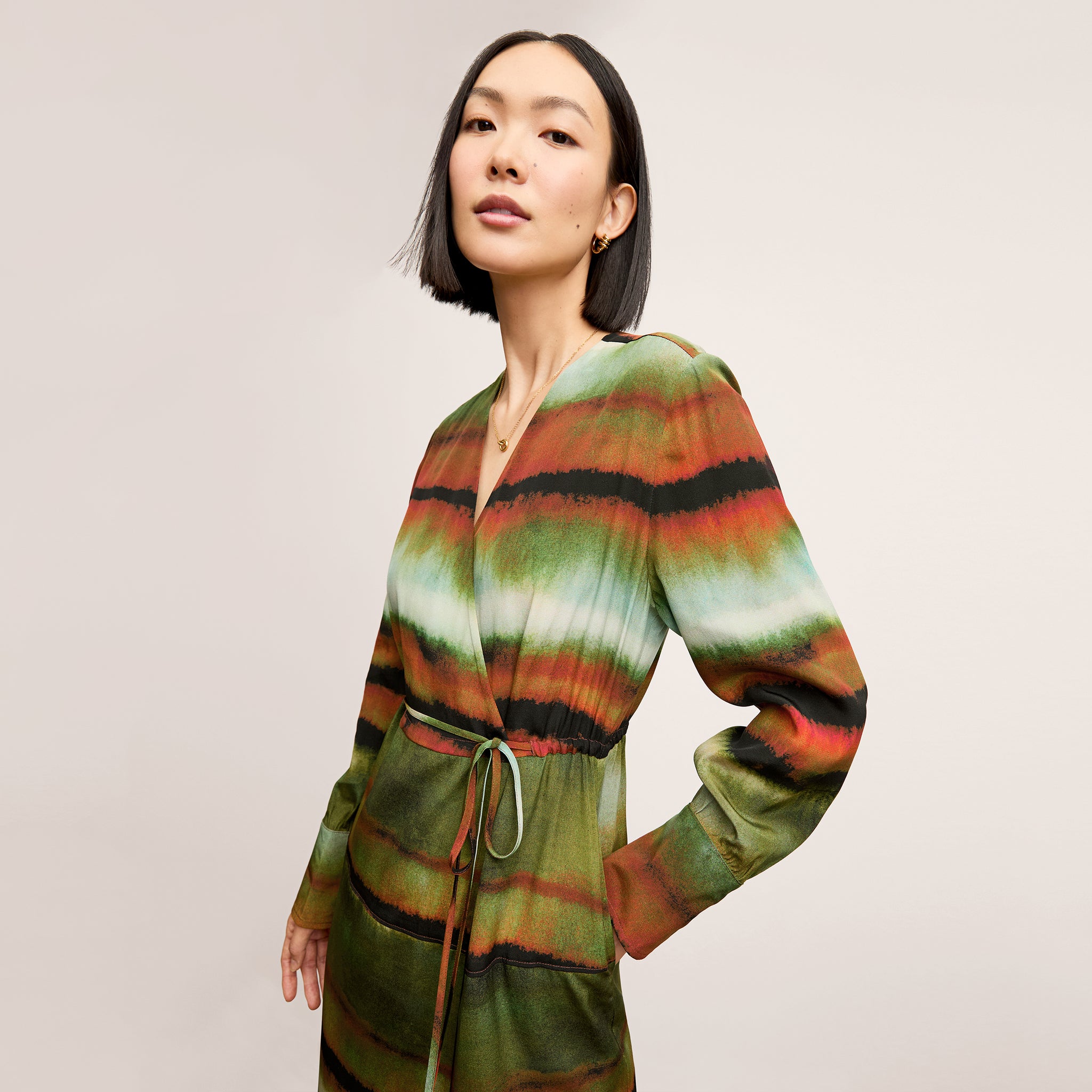 Front image of a woman wearing the Deana dress in Faded Print