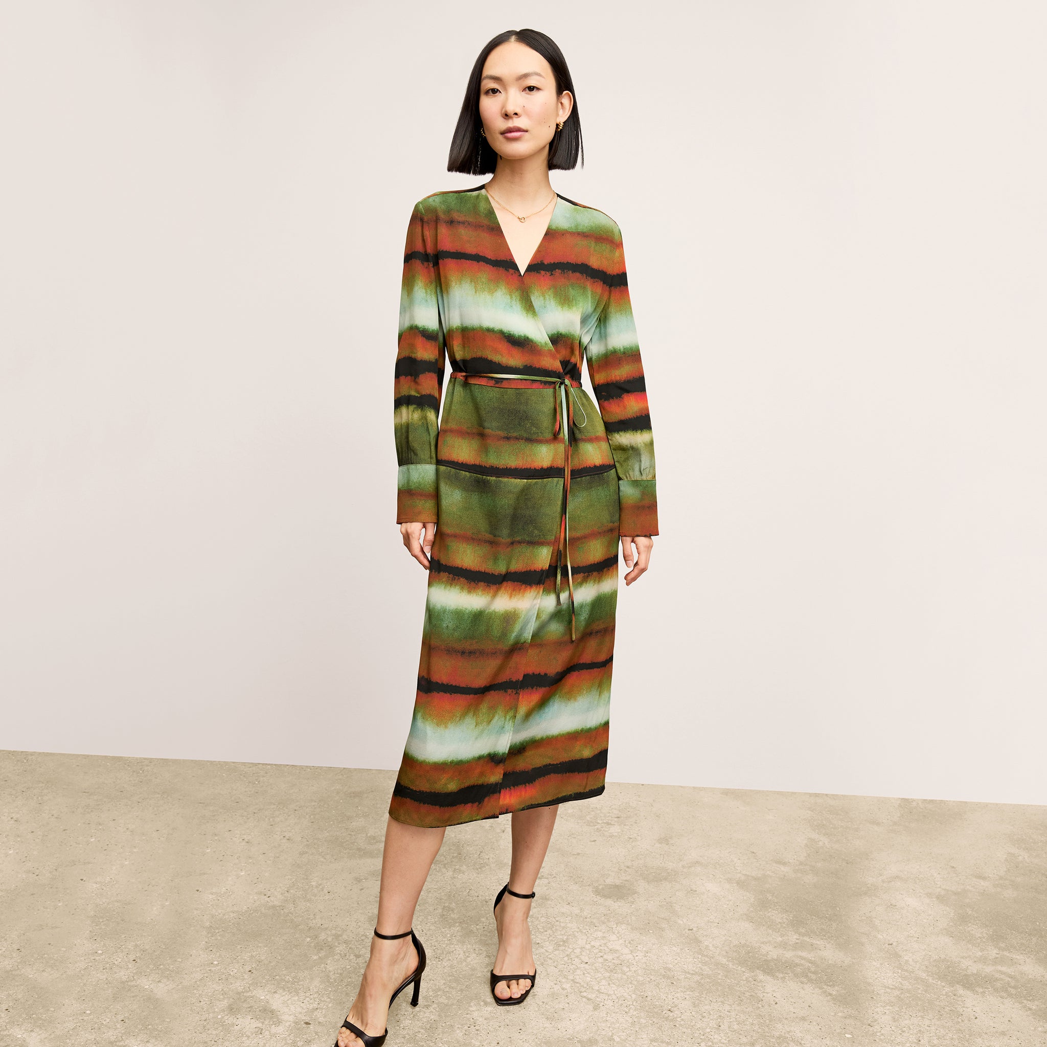 Front image of a woman wearing the Deana dress in Faded Print 