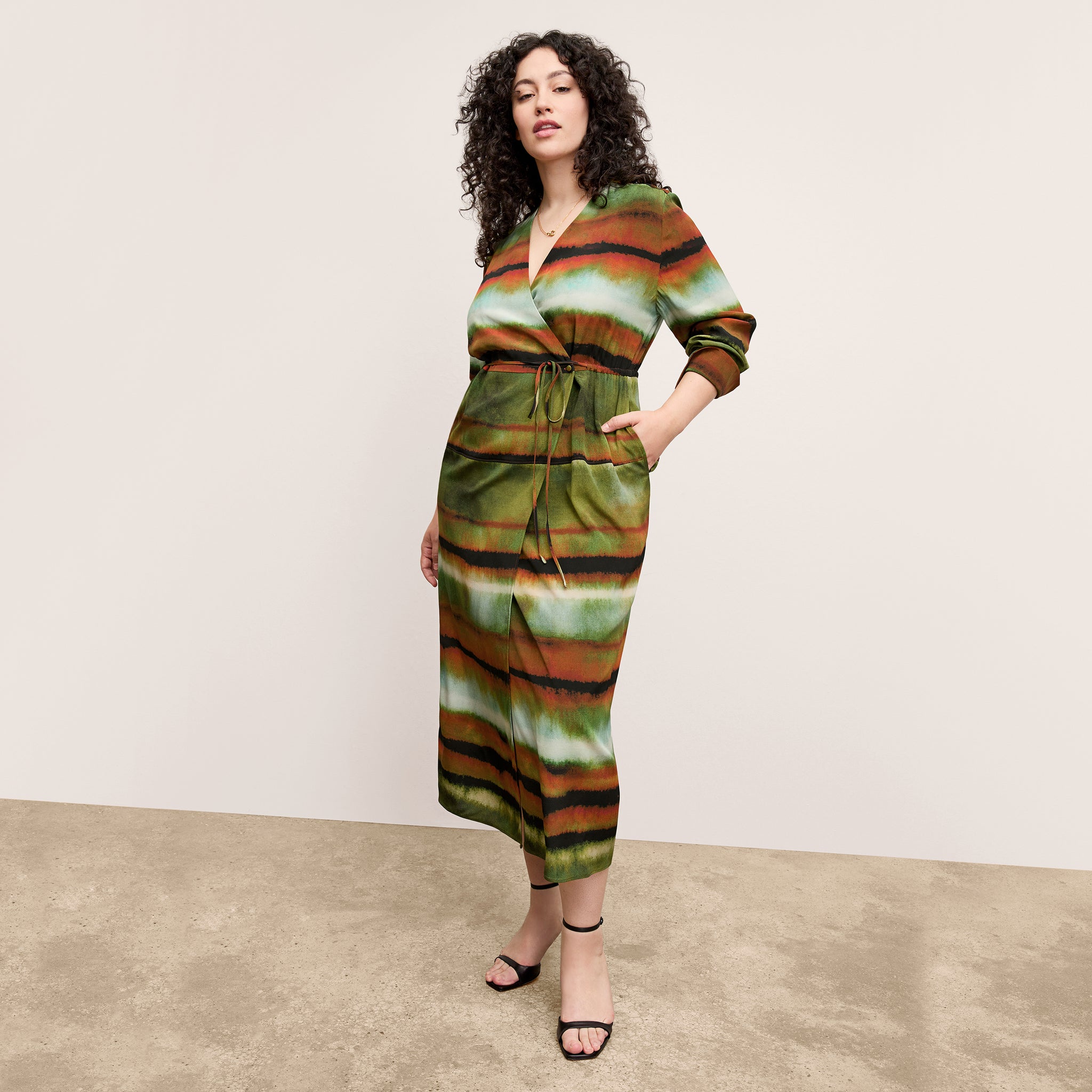 Front image of a woman wearing the Deana dress in Faded Print