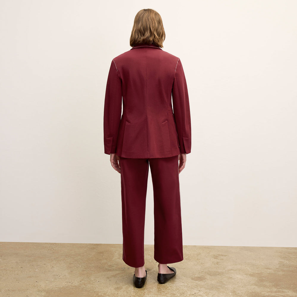 back image of a woman wearing the abby pant in berry jam