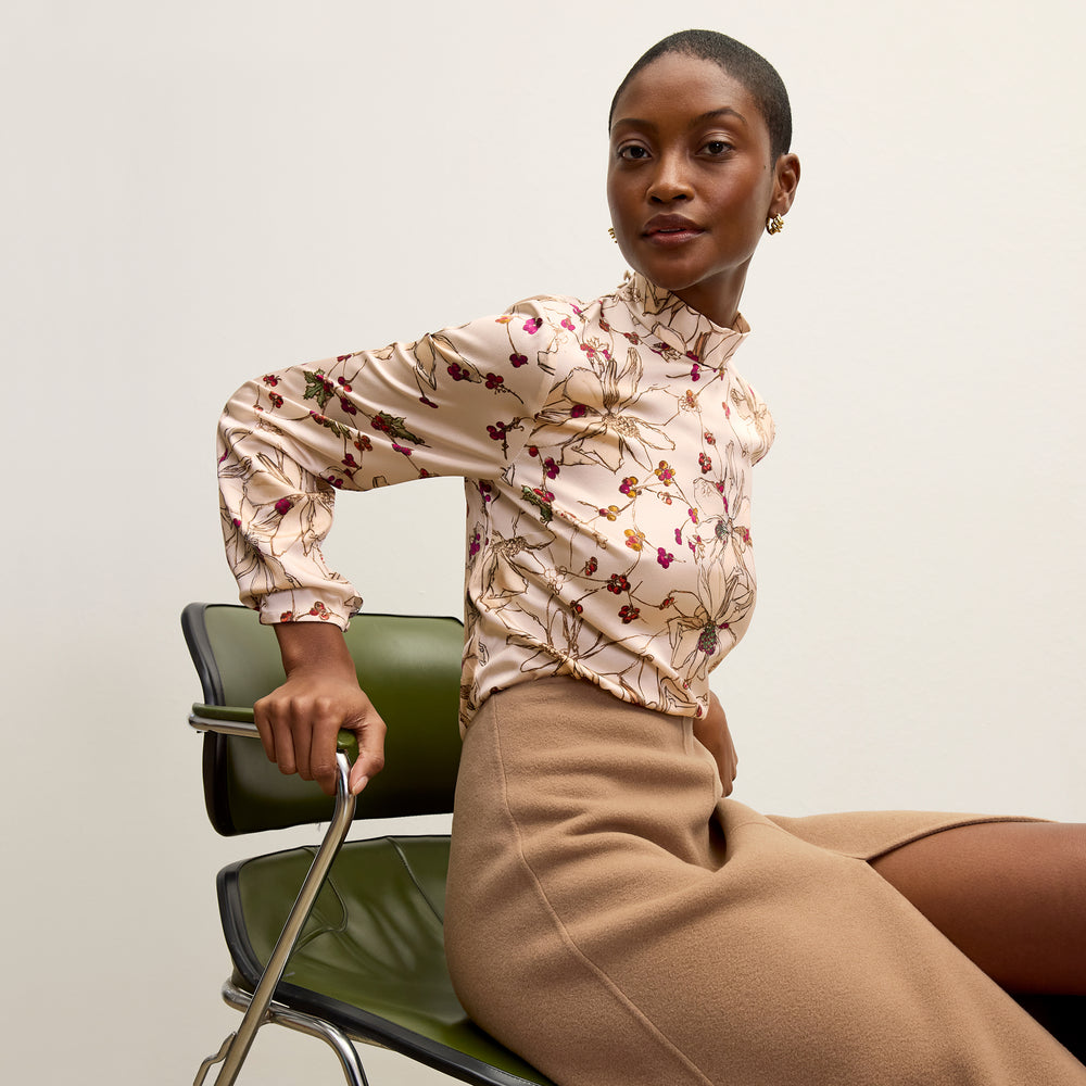 front image of a woman wearing the kerri skirt in camel