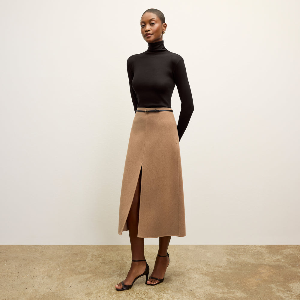 front image of a woman wearing the kerri skirt in camel