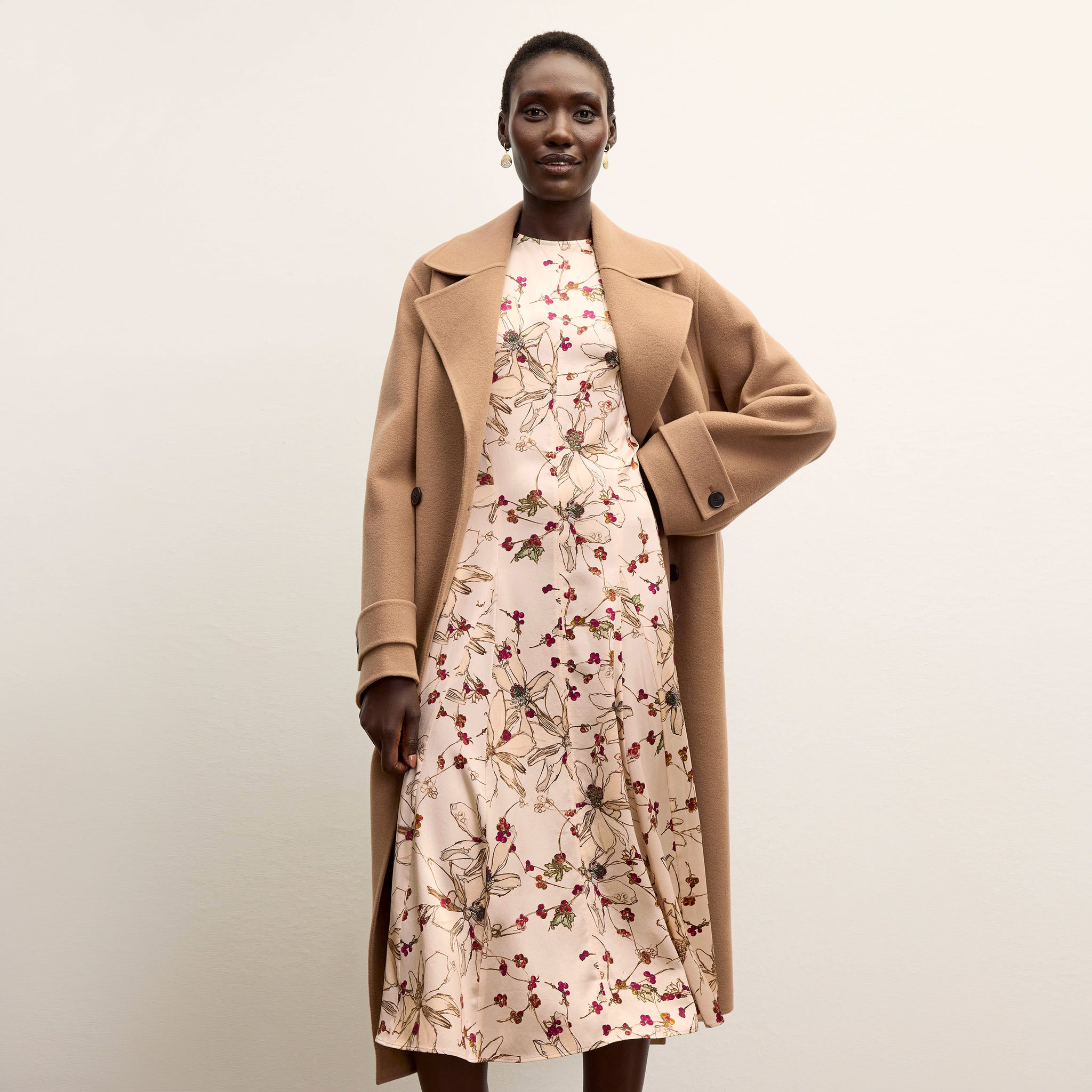 front image of a woman wearing the nyla dress in botanical print 