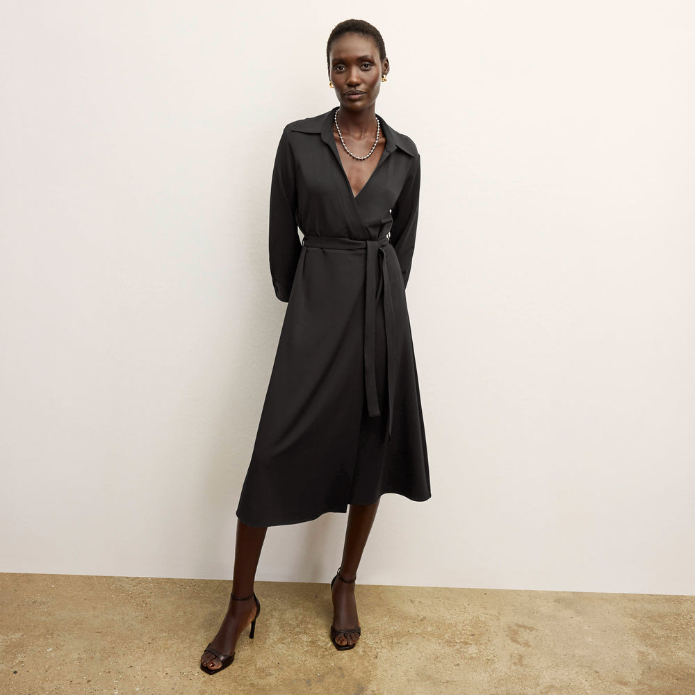 front image of a woman wearing the emmett dress in black