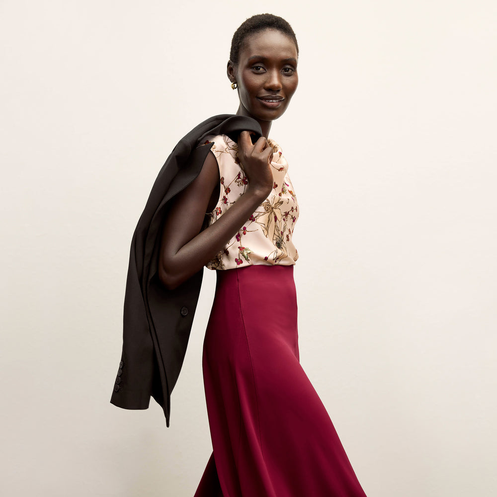 front image of a woman wearing the misty skirt in grenache