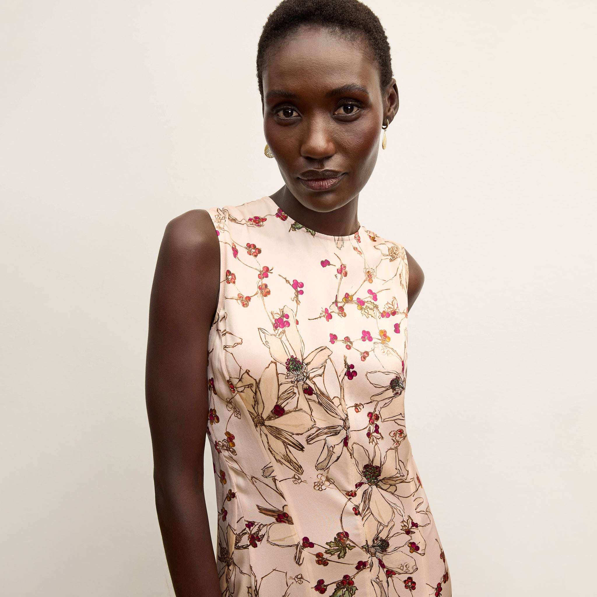 front image of a woman wearing the nyla dress in botanical print