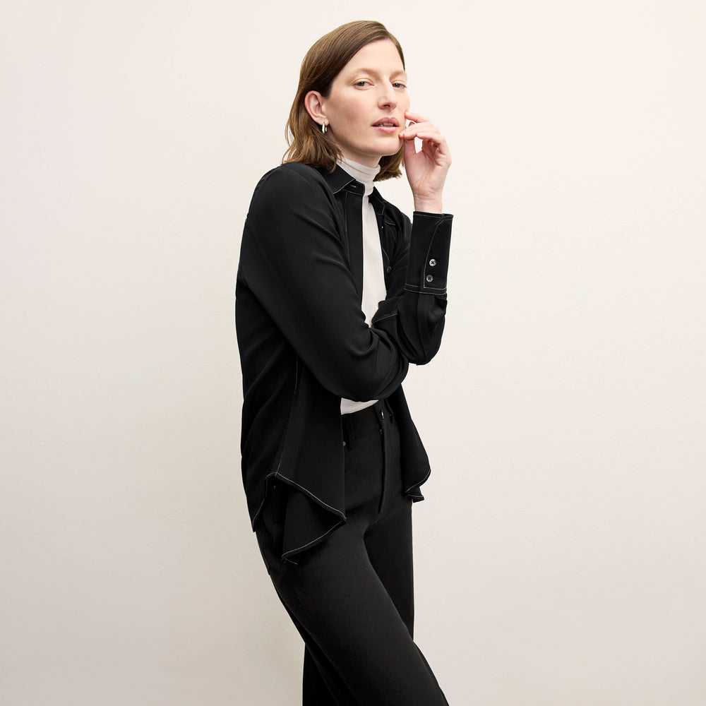 front image of a woman wearing the mira top in black