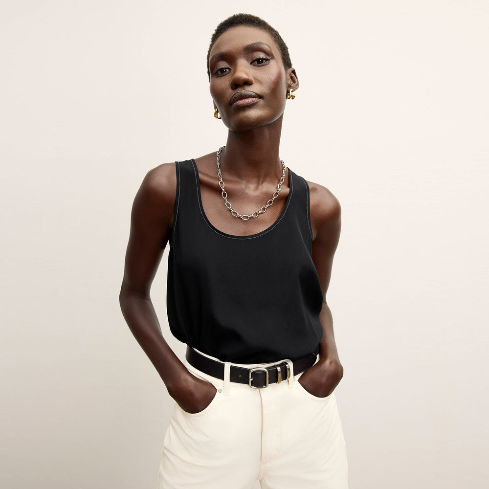 front image of a woman wearing the vicky tank in black