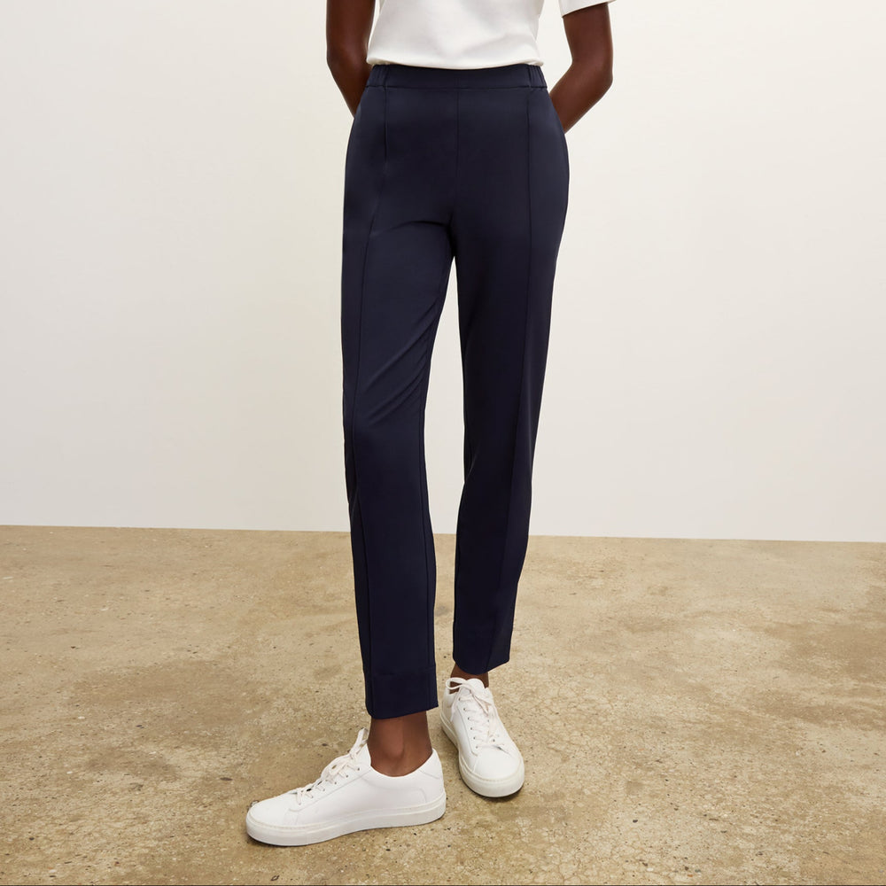 front image of a woman wearing the colby pants in dark navy