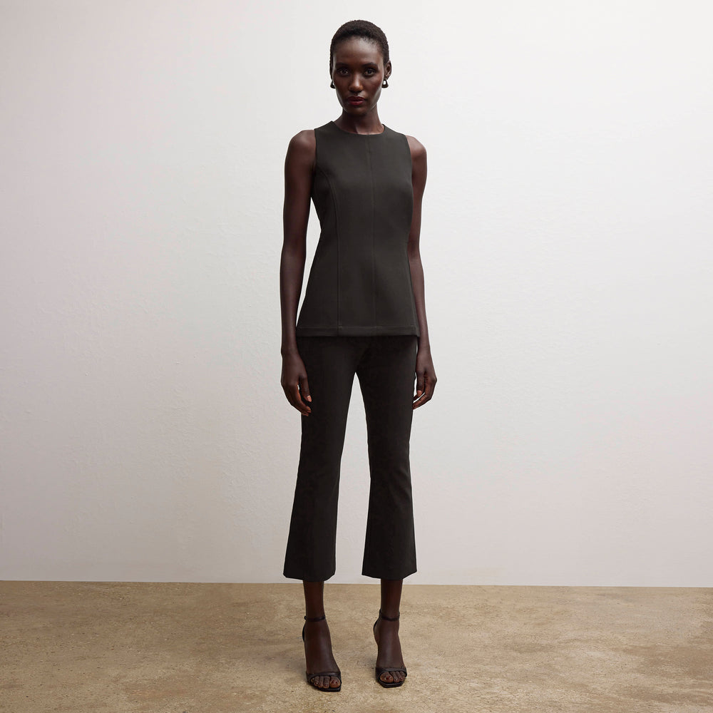 front image of a woman wearing the lucia top in black