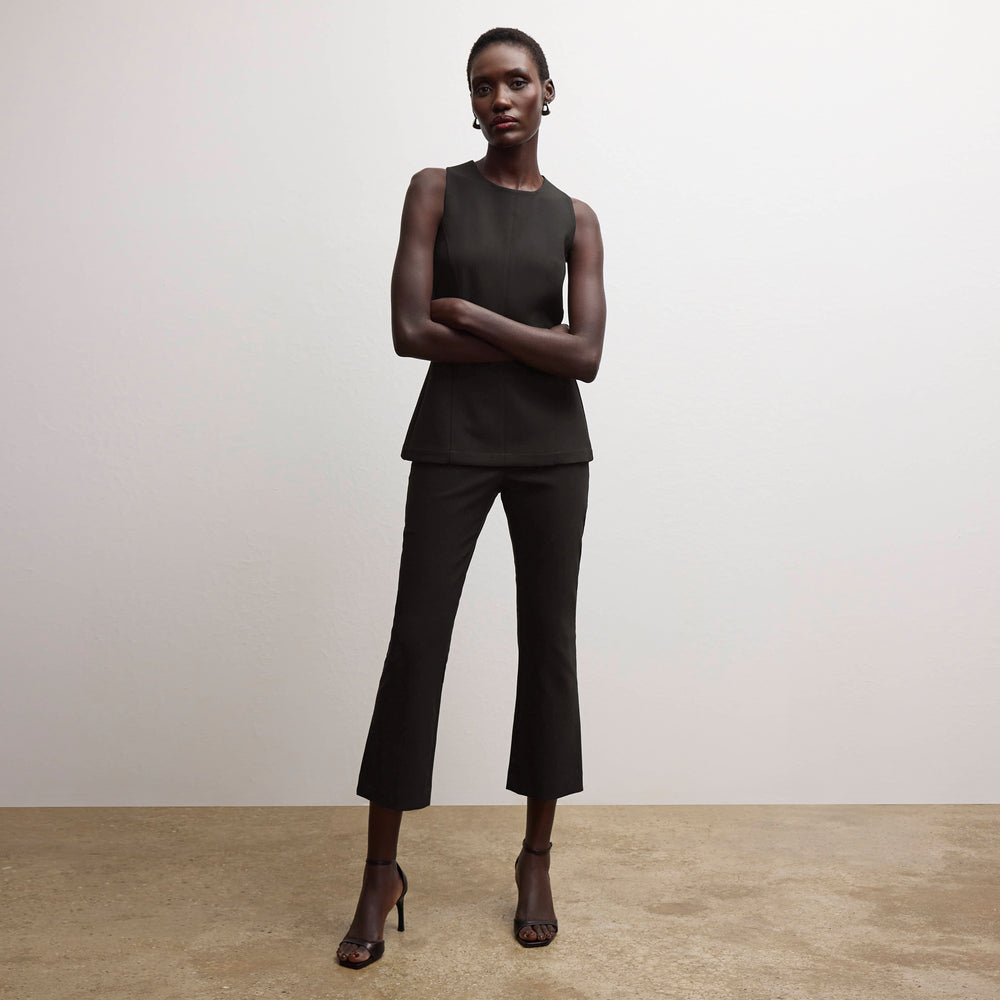 front image of a woman wearing the lucia top in black