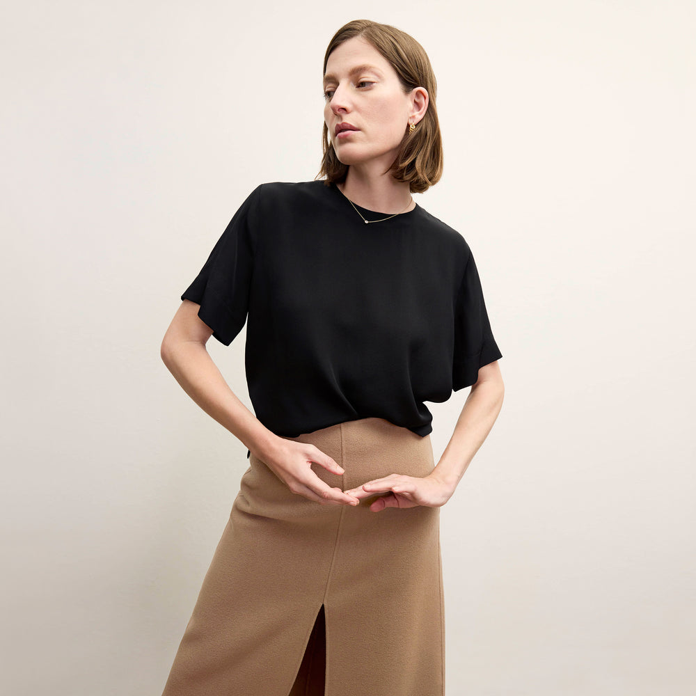 front image of a woman wearing the kerri skirt in camel