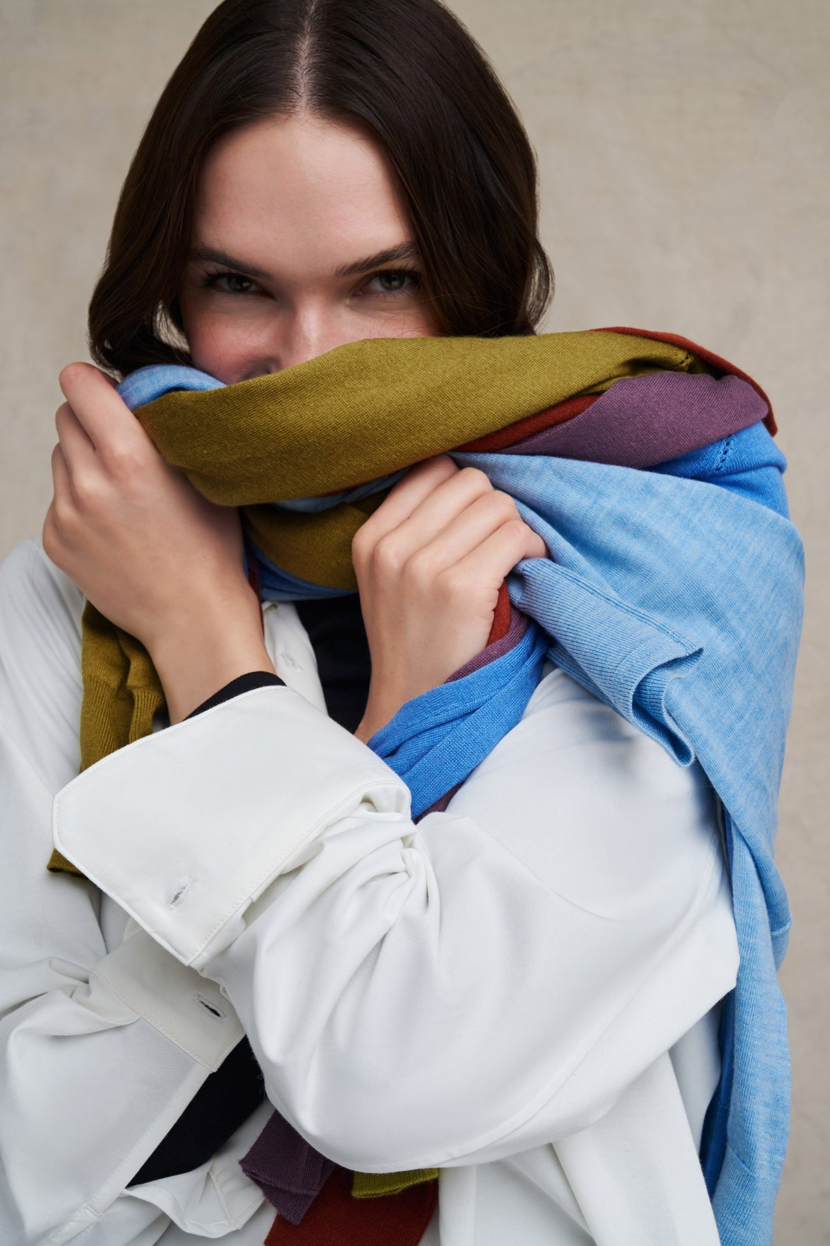 Model wearing a scarf in the season's colors