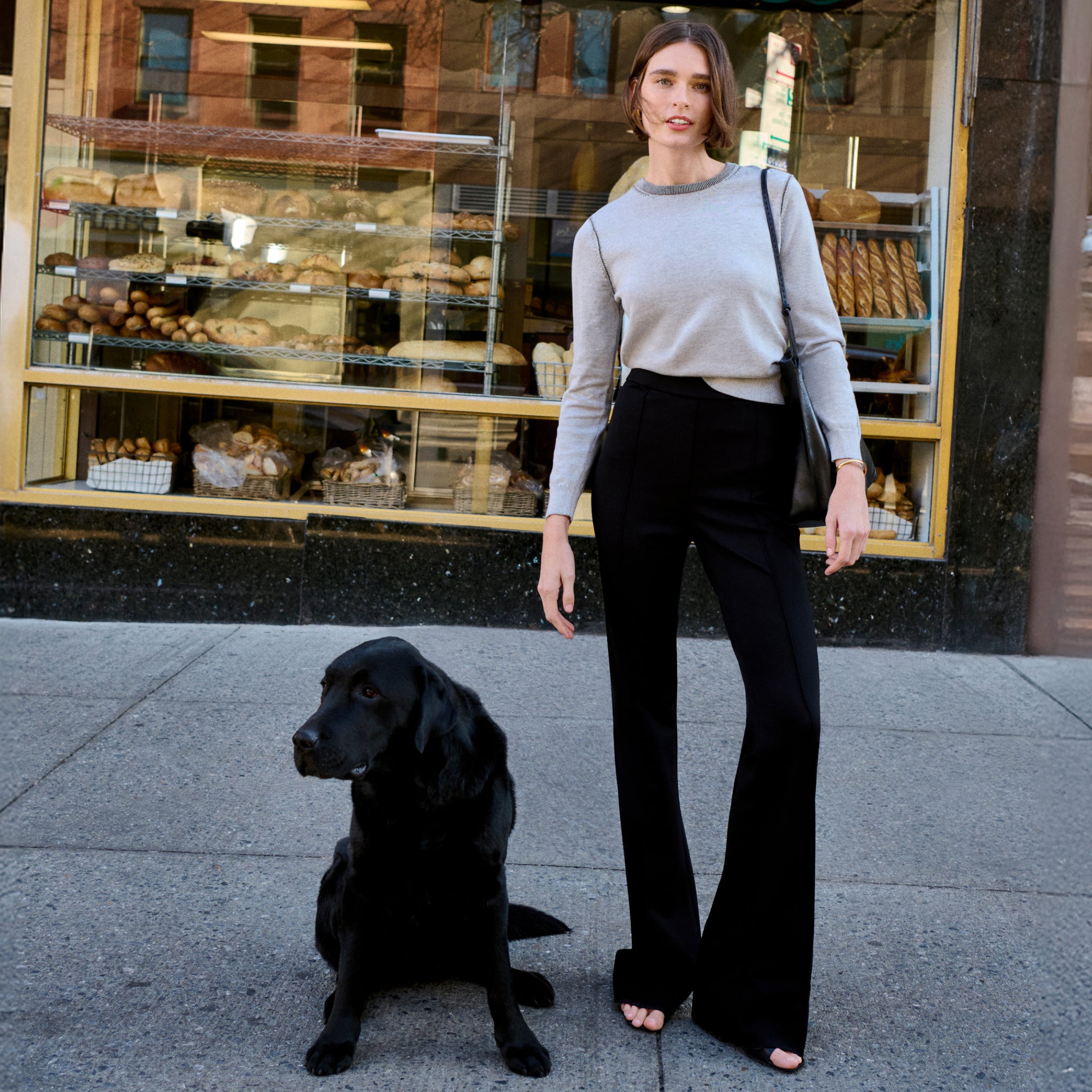 Front image of a woman wearing the hart pant in black