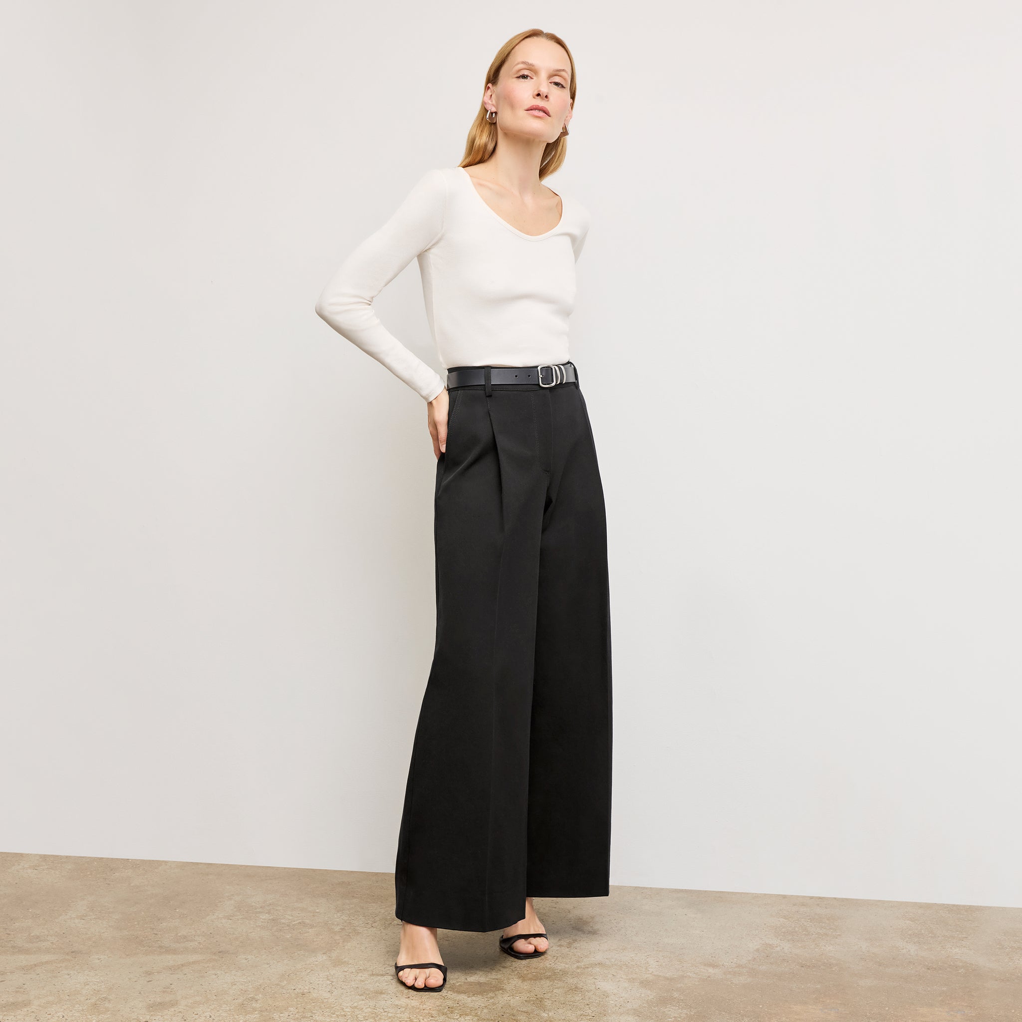 Front image of a woman wearing the Harrison Pant in Black 