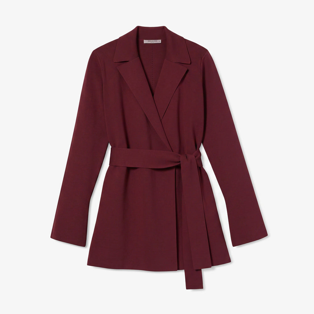 A long-sleeve wrap-style coat in deep burgundy with a matching waist tie belt, shown flat against a light gray background.