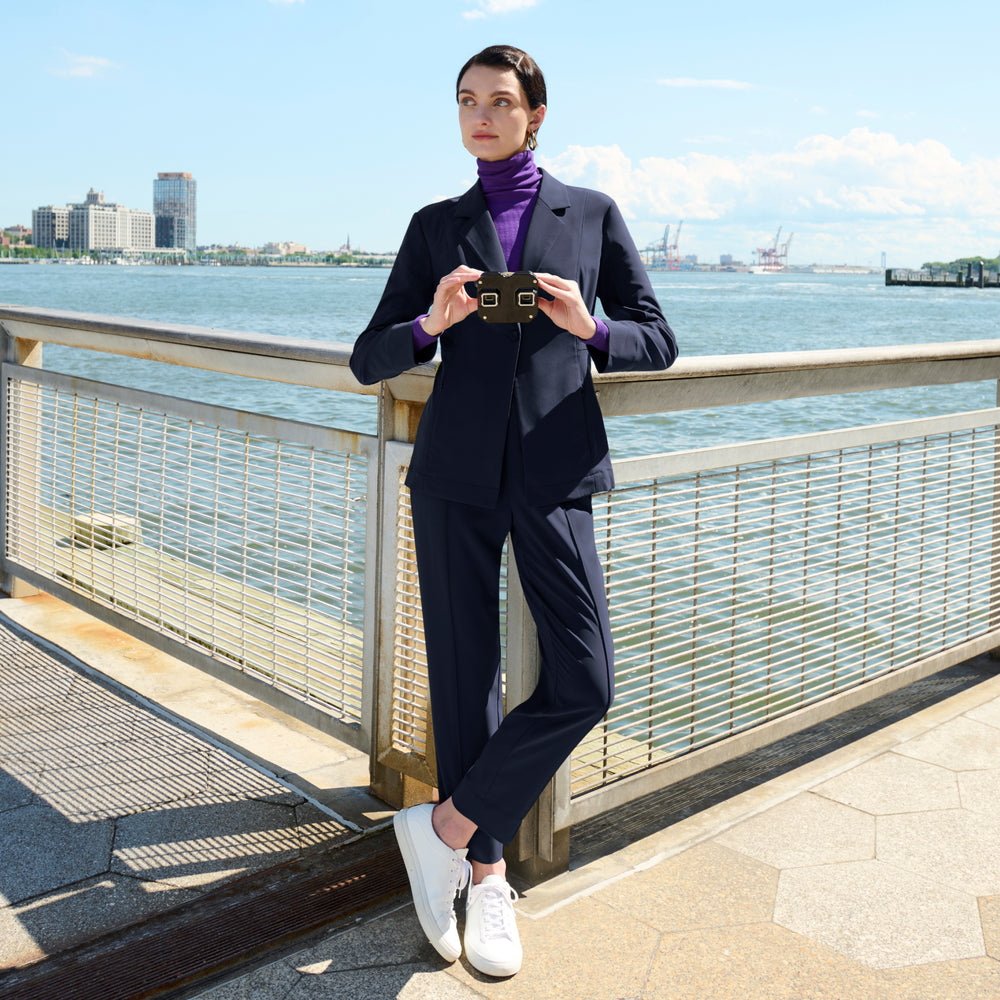 front image of a woman wearing the colby pants in dark navy