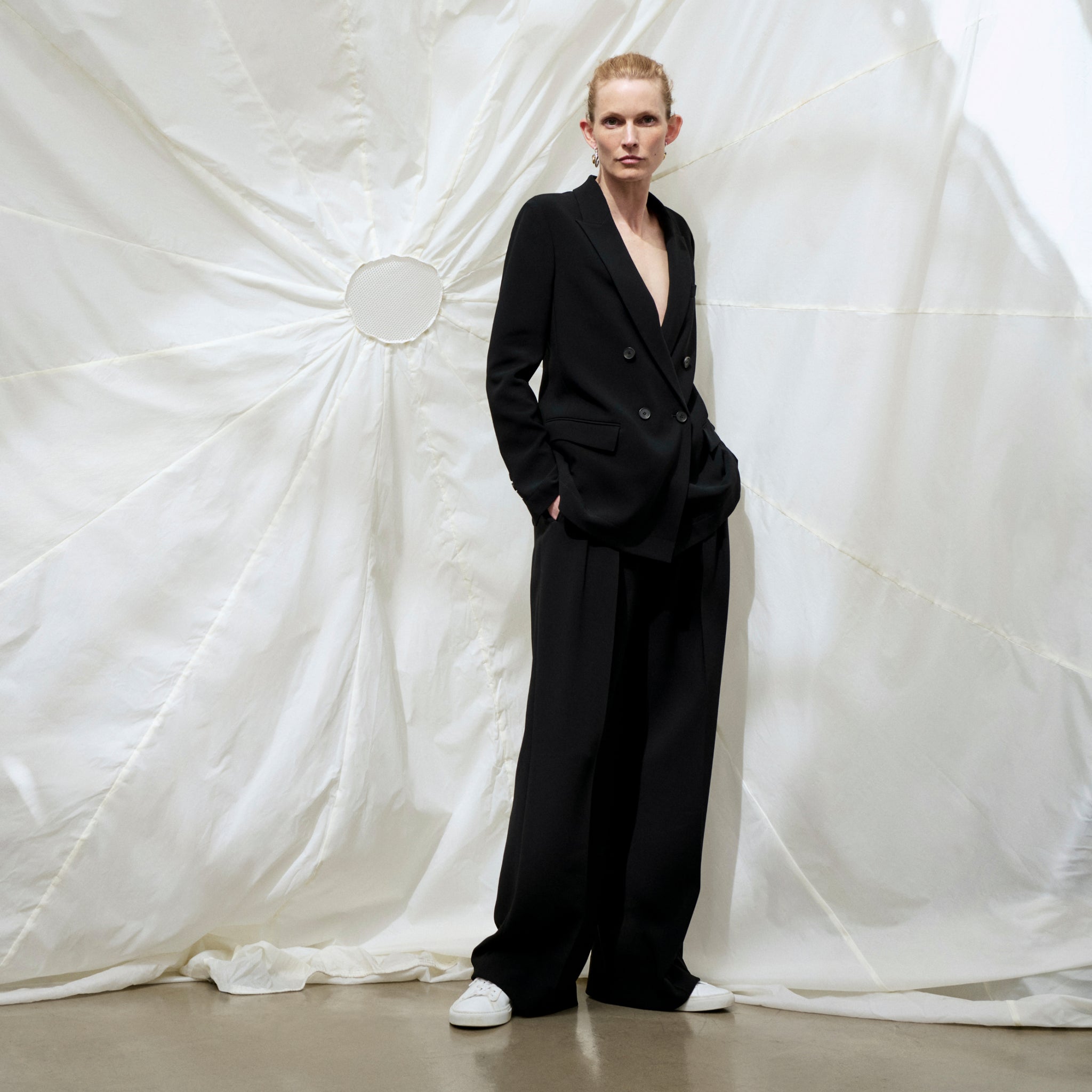 front image of a woman wearing the ohara jacket in black 