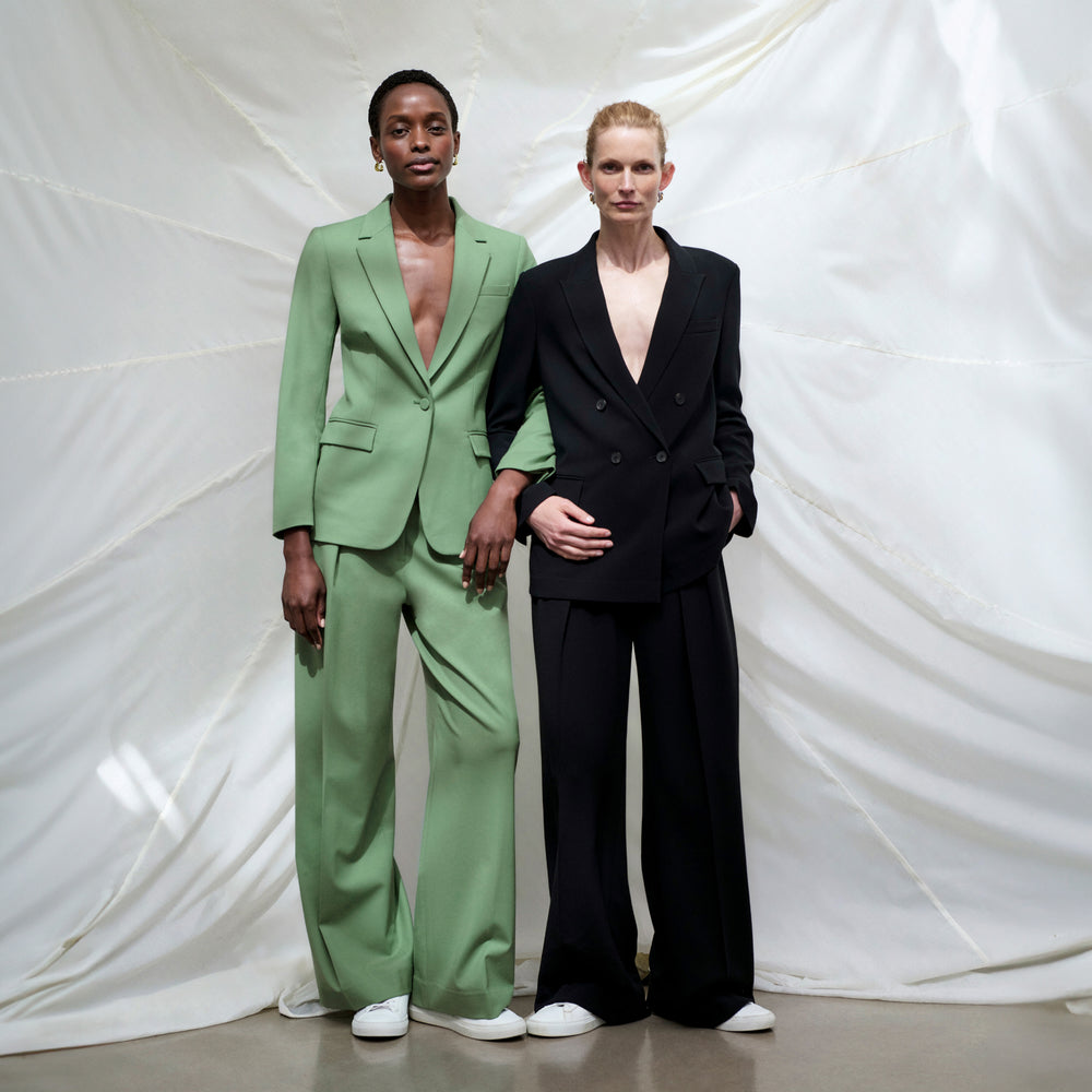 front image of a woman wearing the zuri pants in parisian green